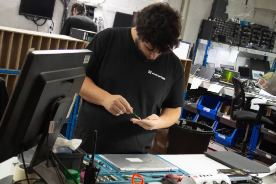 Technician working on a laptop